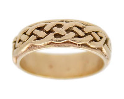 Lot 96 - A 9k gold Celtic band ring.