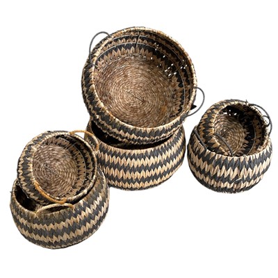 Lot 211 - A set of six Zigzag raffia baskets in...