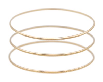 Lot 112 - Three high-purity gold stacking bangles.
