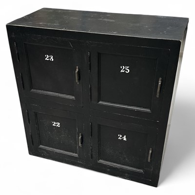 Lot 2 - An ebonised four-door storage cupboard, 87cm...