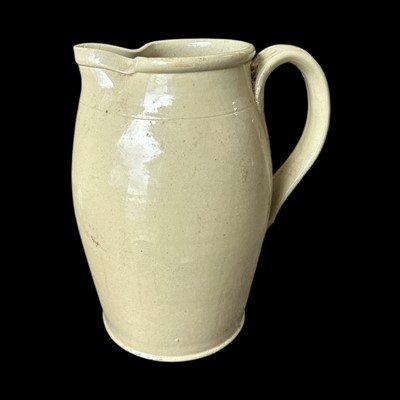 Lot 66 - A stoneware pitcher, 34cm tall.