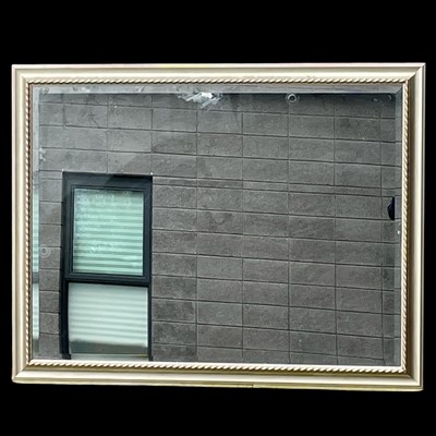 Lot 79 - A bevelled edge gilt finish framed mirror. 104...
