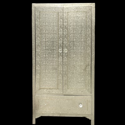 Lot 102 - A white metal Moroccan-style embossed wardrobe,...