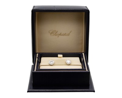 Lot 22 - CHOPARD - A pair of Happy Diamonds 18k white gold earrings.