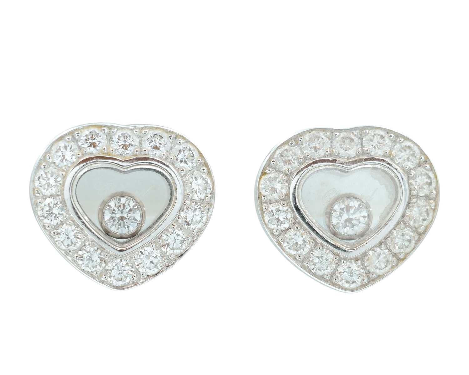 Lot 22 - CHOPARD - A pair of Happy Diamonds 18k white gold earrings.