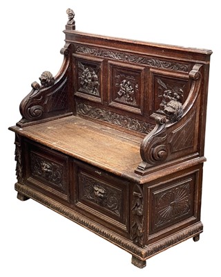 Lot 678 - A late Victorian carved oak bench.