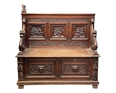 Lot 678 - A late Victorian carved oak bench.