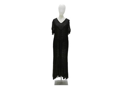 Lot 559 - A black lace flapper dress.