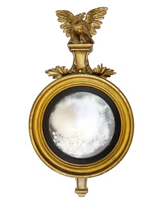 Lot 516 - A Regency giltwood and gesso convex mirror.