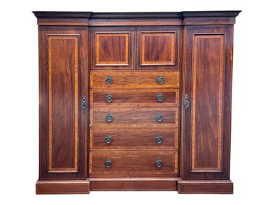 Lot 906 - An Edwardian mahogany and satinwood banded inverted breakfront wardrobe.
