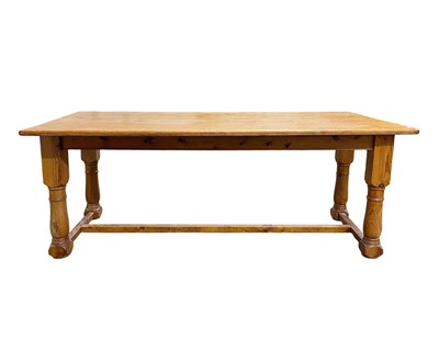 Lot 910 - A pine farmhouse table.