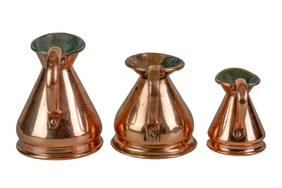 Lot 41 - Six graduated copper measuring jugs.