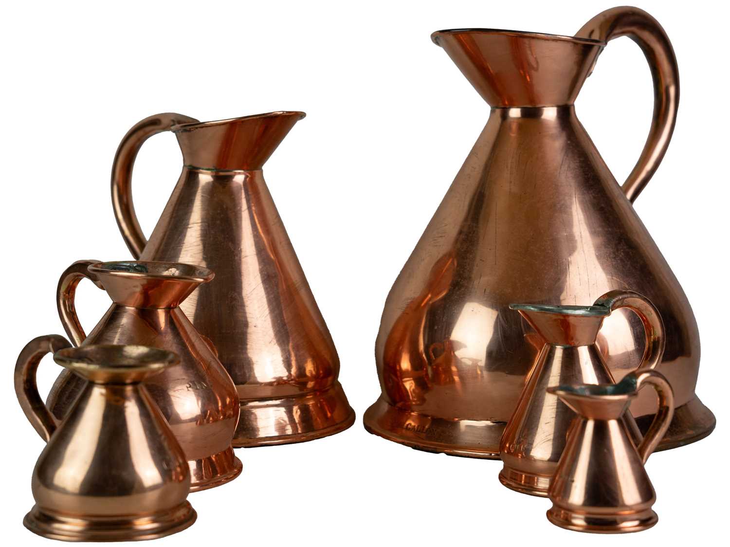 Lot 41 - Six graduated copper measuring jugs.