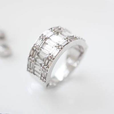 Lot 142 - An impressive, heavy platinum diamond set, a half eternity cluster ring.
