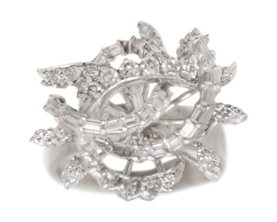 Lot 139 - An 18k white gold and diamond dress ring.