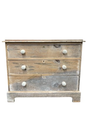 Lot 743 - A late Victorian pine chest of three long drawers.