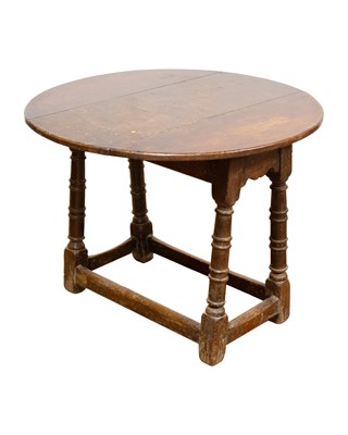 Lot 805 - An oak circular occasional table.