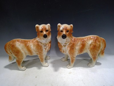 Lot 170 - Two Staffordshire Standing Dogs. The Dogs are...