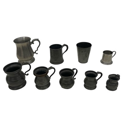 Lot 186 - A collection of Pewter tankards, including a...