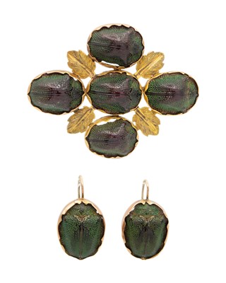 Lot 162 - An Egyptian revival gold scarab beetle brooch and a matching pair of earrings.