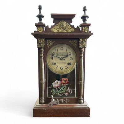 Lot 71 - A Chinese made mantel clock retailed by...