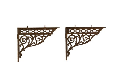 Lot 97 - A pair of Victorian cast iron shelf brackets.