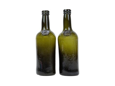 Lot 738 - Two sealed green glass half wine bottles.