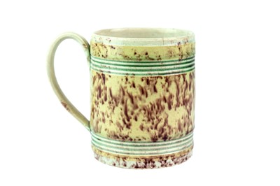 Lot 764 - A fine engine turned creamware mug or can.