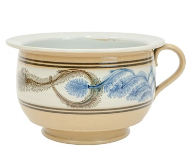 Lot 718 - A late 19th century mocha ware chamber pot.