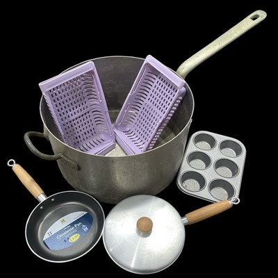 Lot 54 - A very large steel and brass saucepan, 41cm in...