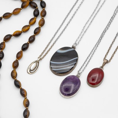 Lot 7 - A selection of five silver and gemstone necklaces.
