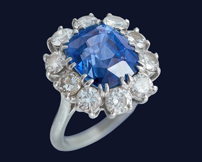 Lot 180 - An exceptional certified 9.40ct Burmese sapphire and diamond cluster ring.