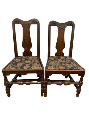 Lot 702 - A pair of 18th century oak side chairs.