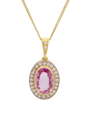Lot 144 - An 18k gold, pink topaz and diamond halo pendant on a silver gilt chain.