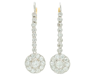 Lot 146 - A pair of daisy drop earrings in white and yellow gold.