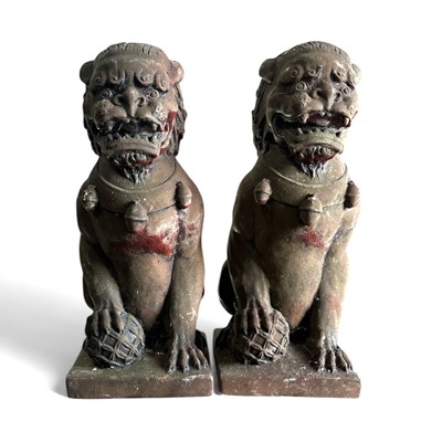 Lot 137 - Two resin dogs of Foo or shishi, the larger of...
