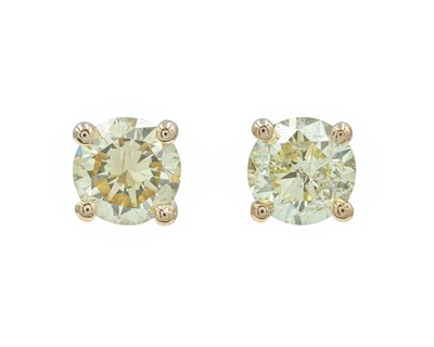 Lot 152 - An 18k rose gold fancy yellow diamond solitaire stud earrings.