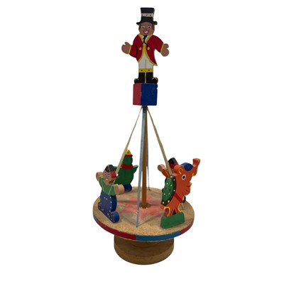 Lot 142 - A wooden carousel with painted figures, 44cm...