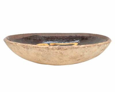 Lot 622 - An English slipware pottery colander or strainer dish.