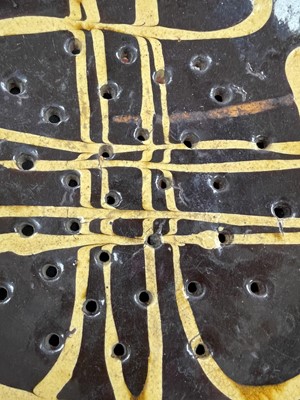 Lot 622 - An English slipware pottery colander or strainer dish.