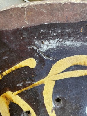 Lot 622 - An English slipware pottery colander or strainer dish.