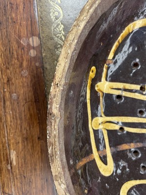 Lot 622 - An English slipware pottery colander or strainer dish.