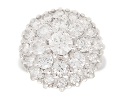Lot 164 - An 18k white gold diamond tiered cluster ring.