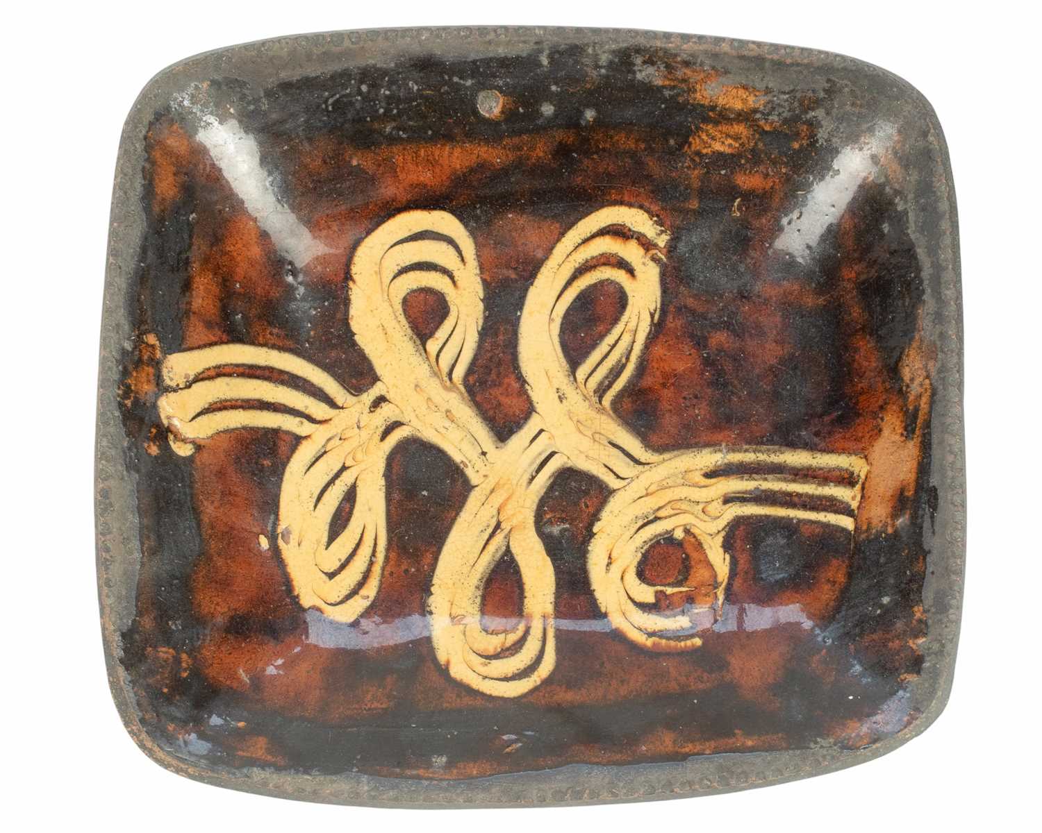 Lot 634 - A large slipware baking or loaf dish.