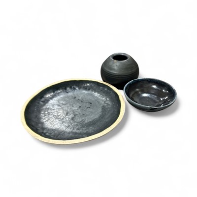 Lot 147 - Three items of studio: the large plate is 27cm...