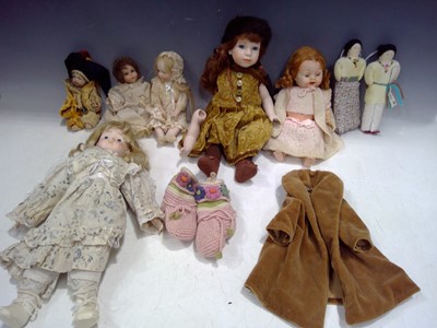 Lot 155 - A Selection of Bisque Dolls and Two Navajo Dolls.