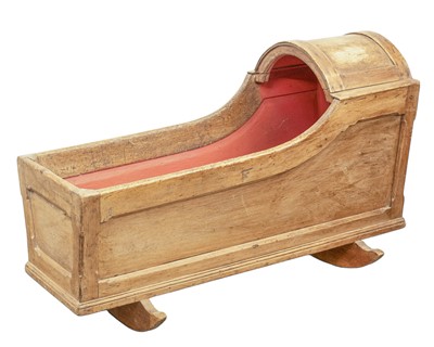 Lot 652 - A pine rocking baby crib.