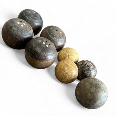 Lot 125 - Four vintage wooden lawn bowls, and four others.