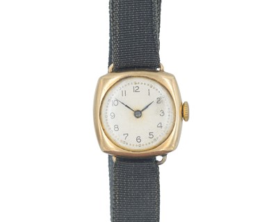 Lot 1003 - A 9k cushion-cased 1930's lady's manual wind wristwatch.