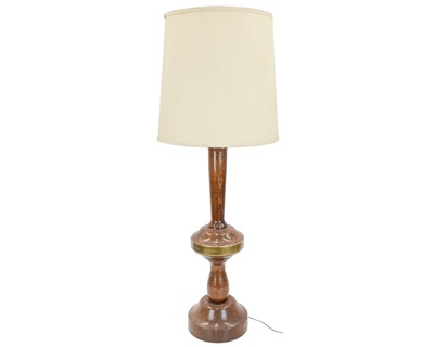 Lot 264 - An oversized wood and brass table lamp.